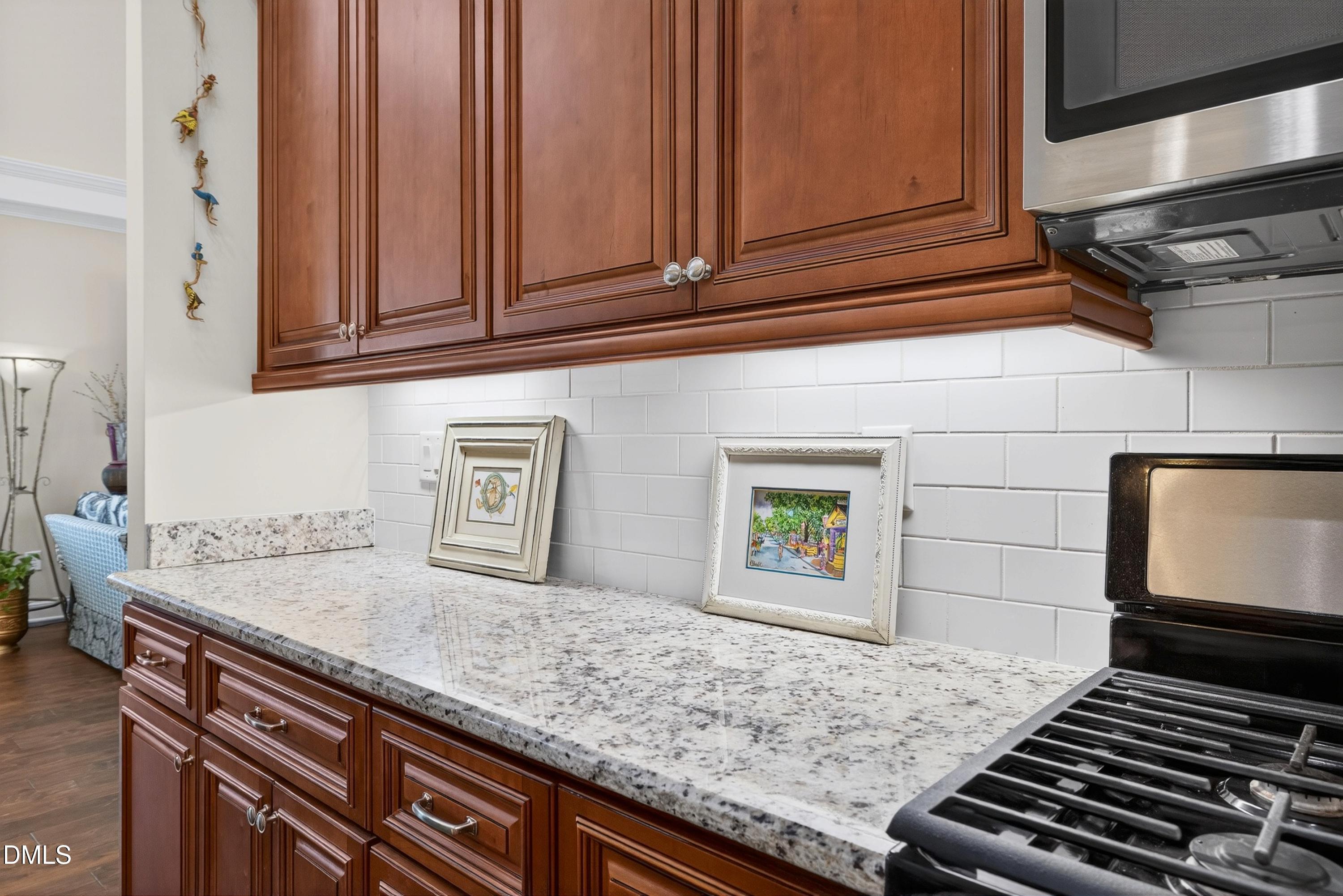 121 Telluride Trail Garner, NC 27529 - Photo 6 of 41 a kitchen with granite countertop a sink and a stove