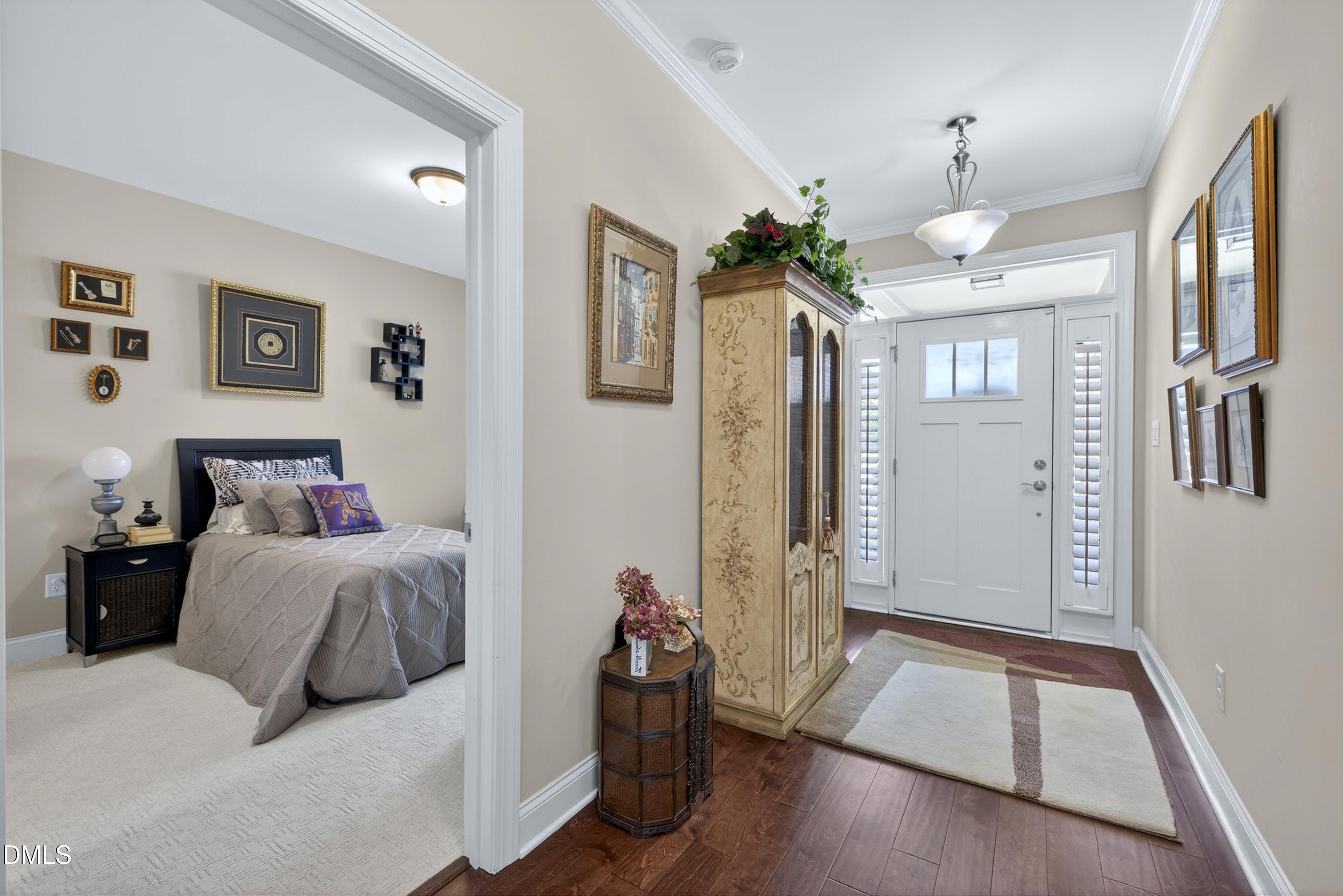 121 Telluride Trail Garner, NC 27529 - Photo 7 of 41 a bedroom with furniture and wooden floor