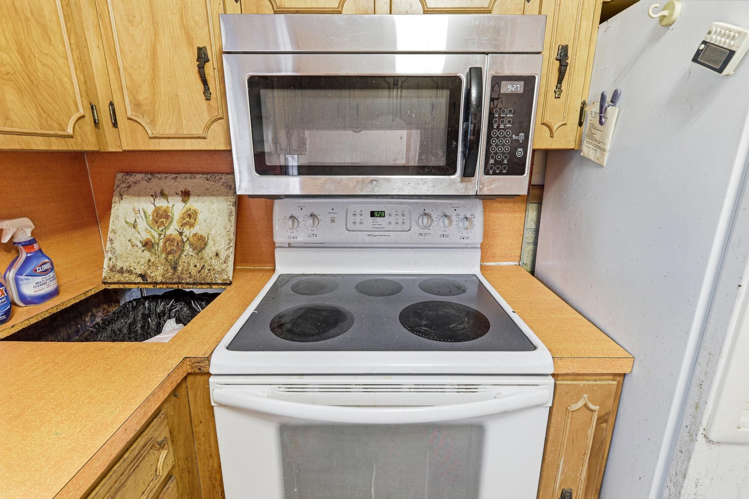 13896 Rockingham Pike Elkton, VA 22827 - Photo 27 of 60 a stove top oven sitting inside of a kitchen