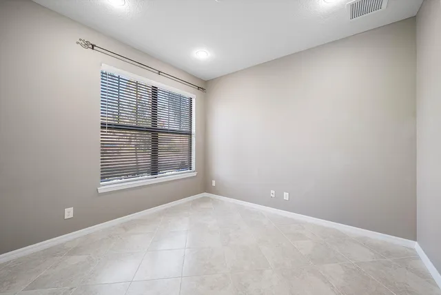 a view of a hallway with wooden shelves