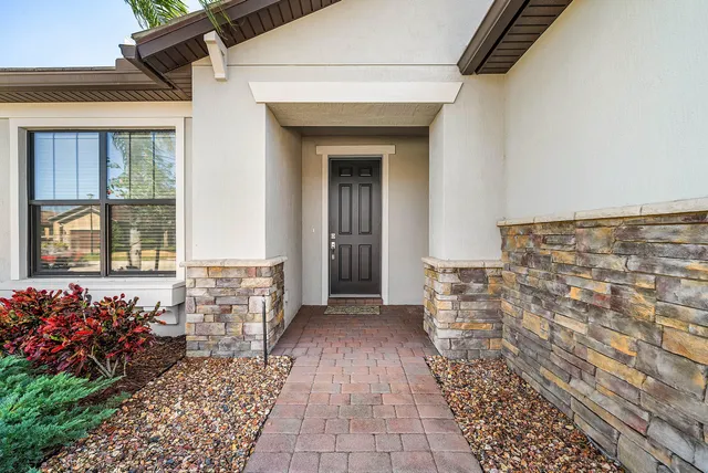 a large kitchen with stainless steel appliances kitchen island granite countertop a large counter top and stainless steel appliances