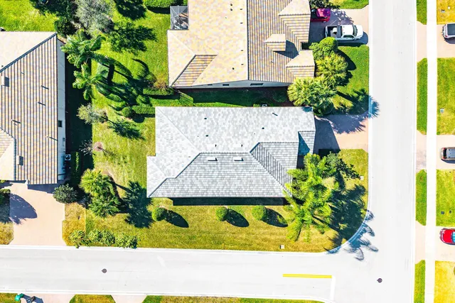 an aerial view of residential houses with outdoor space