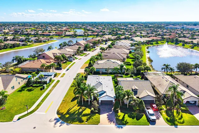 an aerial view of residential houses with outdoor space