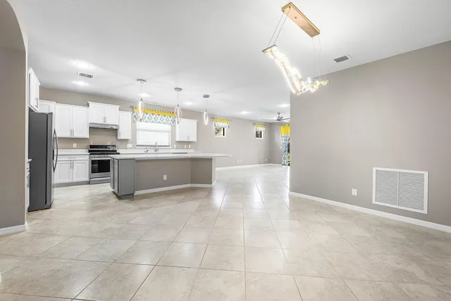 a kitchen with stainless steel appliances a sink stove and refrigerator