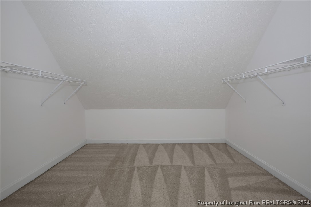 5808 Spreading Branch Road Hope Mills, NC 28348 - Photo 19 of 35 a view of a room with racks on the wall