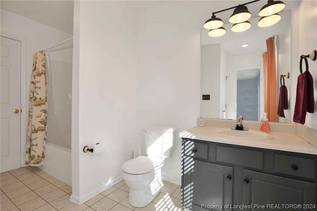 5808 Spreading Branch Road Hope Mills, NC 28348 - Photo 24 of 35 a bathroom with a sink vanity granite and toilet
