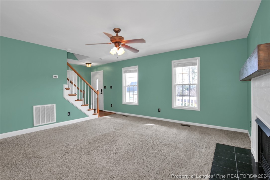 5808 Spreading Branch Road Hope Mills, NC 28348 - Photo 8 of 35 a view of a livingroom with a ceiling fan and window