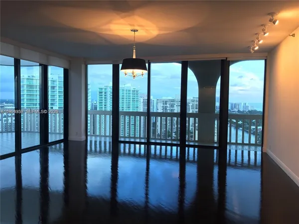 a view of a room with wooden floor balcony