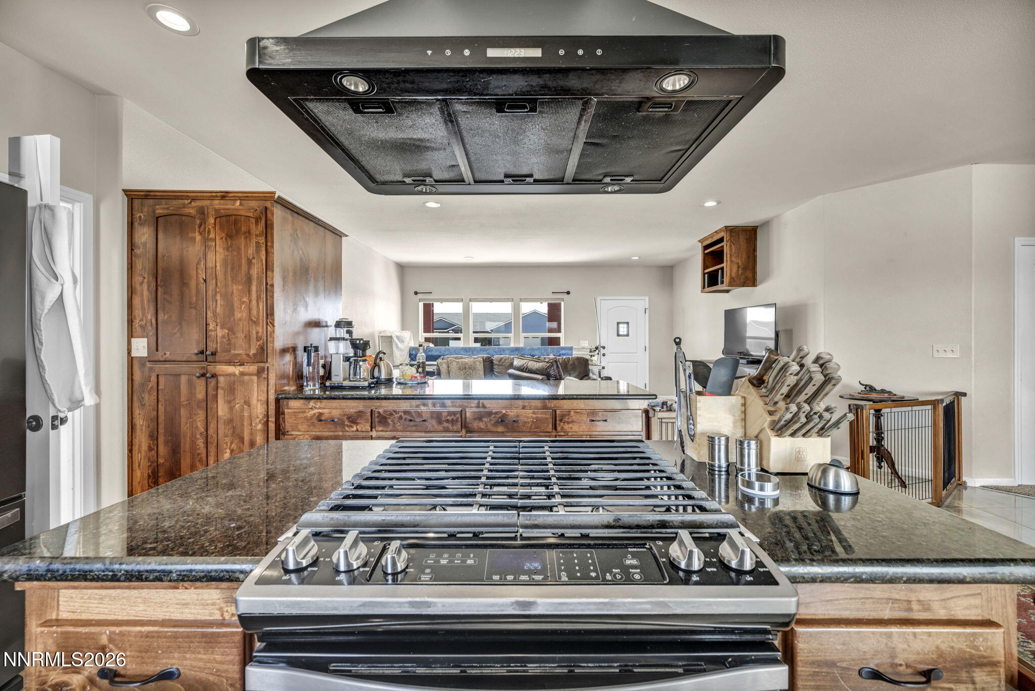 1286 Sky Ridge Drive Fallon, NV 89406 - Photo 12 of 49 a kitchen with stainless steel appliances granite countertop a stove and a refrigerator