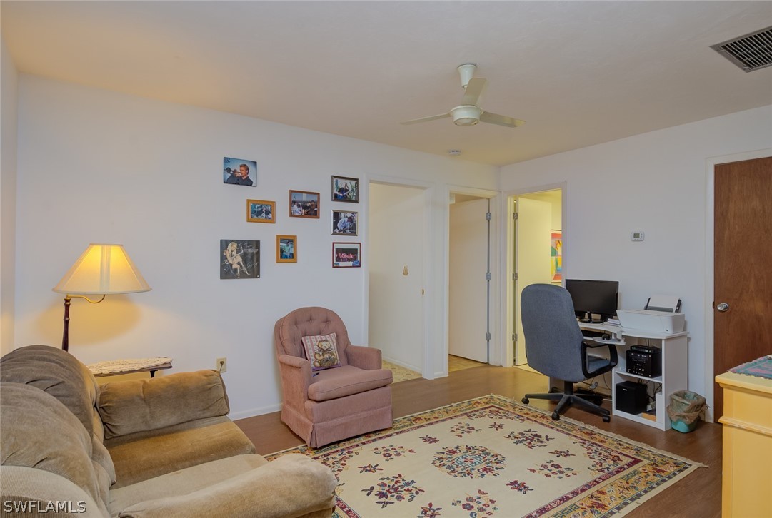 13970 Elkins Road Fort Myers, FL 33913 - Photo 16 of 35 a living room with furniture and a window