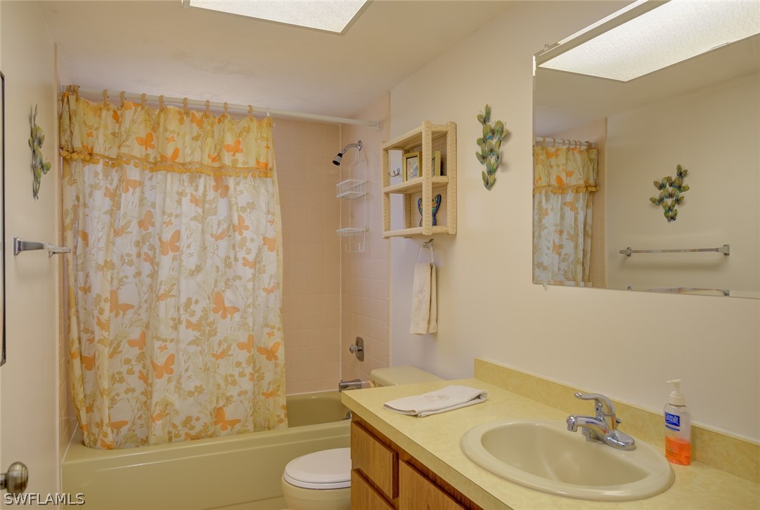 13970 Elkins Road Fort Myers, FL 33913 - Photo 19 of 35 a bathroom with a sink toilet and shower