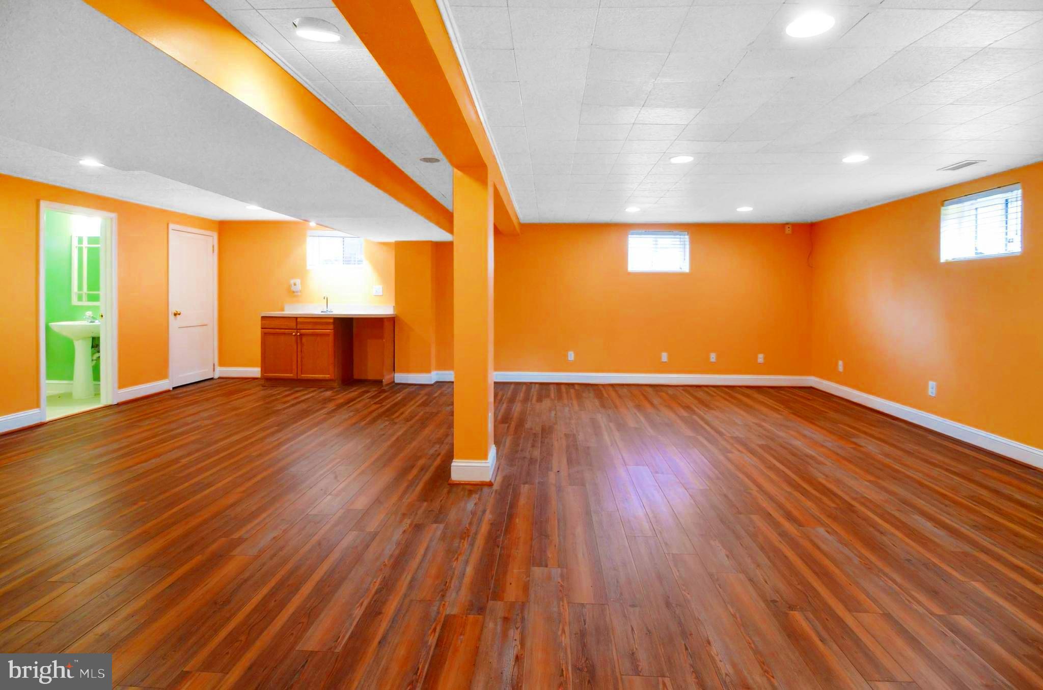 6409 Woodley Road Clinton, MD 20735 - Photo 24 of 30 Basement With Wet Bar and Recessed Lights