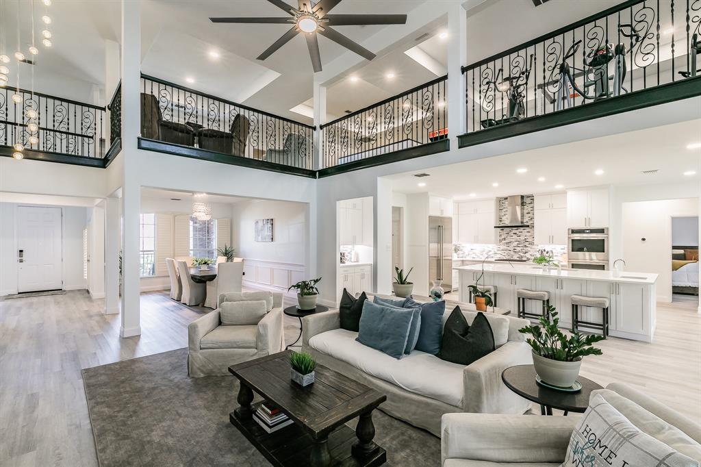 12548 Avondale Ridge Drive Fort Worth, TX 76179 - Photo 1 of 40 Living area with light wood-style floors and a towering ceiling