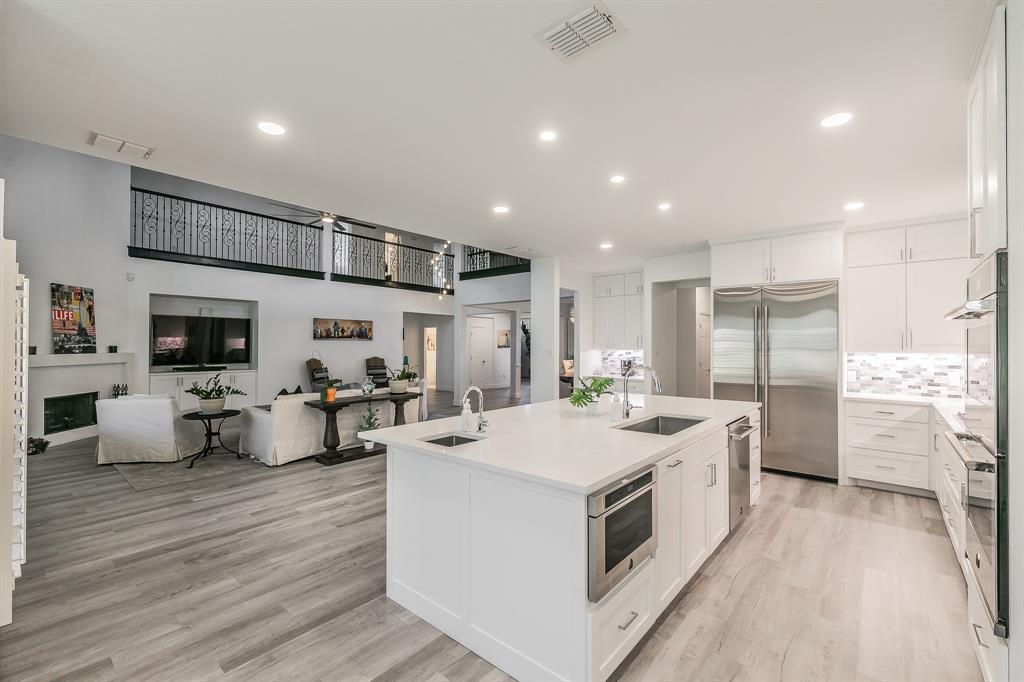 12548 Avondale Ridge Drive Fort Worth, TX 76179 - Photo 17 of 40 Kitchen featuring a kitchen island with sink, visible vents, stainless steel appliances, and a sink