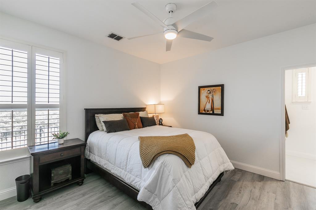 12548 Avondale Ridge Drive Fort Worth, TX 76179 - Photo 24 of 40 1st floor Bedroom with light wood-type flooring, visible vents, baseboards, and ceiling fan