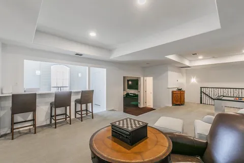 a room with gym equipment and mirrors