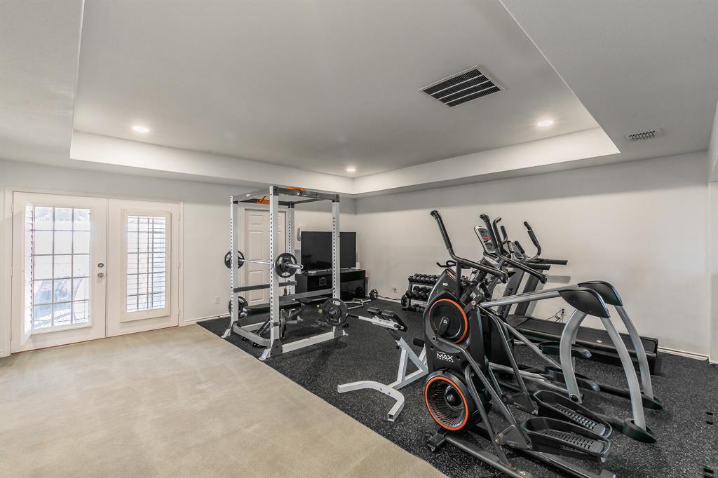 12548 Avondale Ridge Drive Fort Worth, TX 76179 - Photo 28 of 40 Exercise room featuring visible vents, baseboards, recessed lighting, french doors, and a raised ceiling