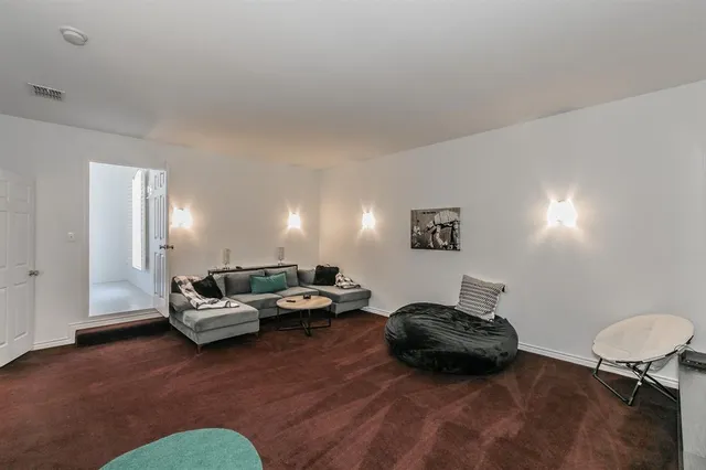 a bed room with a bed and a chair