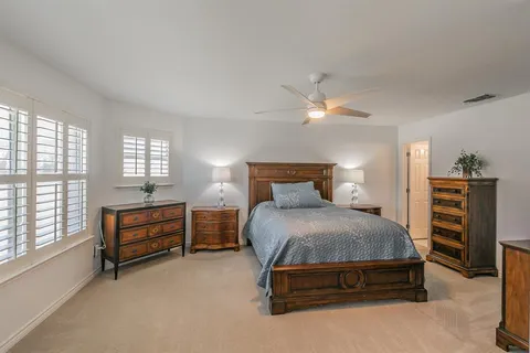 a view of a patio with a table and chairs