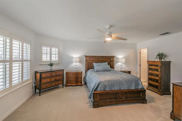 a view of a patio with a table and chairs