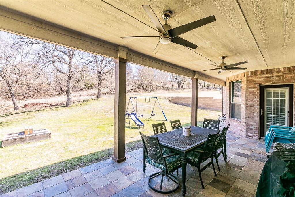 12548 Avondale Ridge Drive Fort Worth, TX 76179 - Photo 37 of 40 View of patio with outdoor dining space, a playground, and ceiling fan