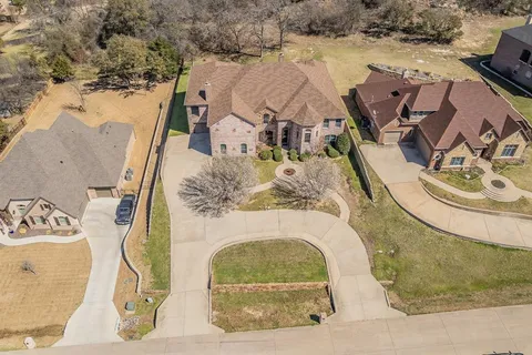 an aerial view of a house with outdoor space