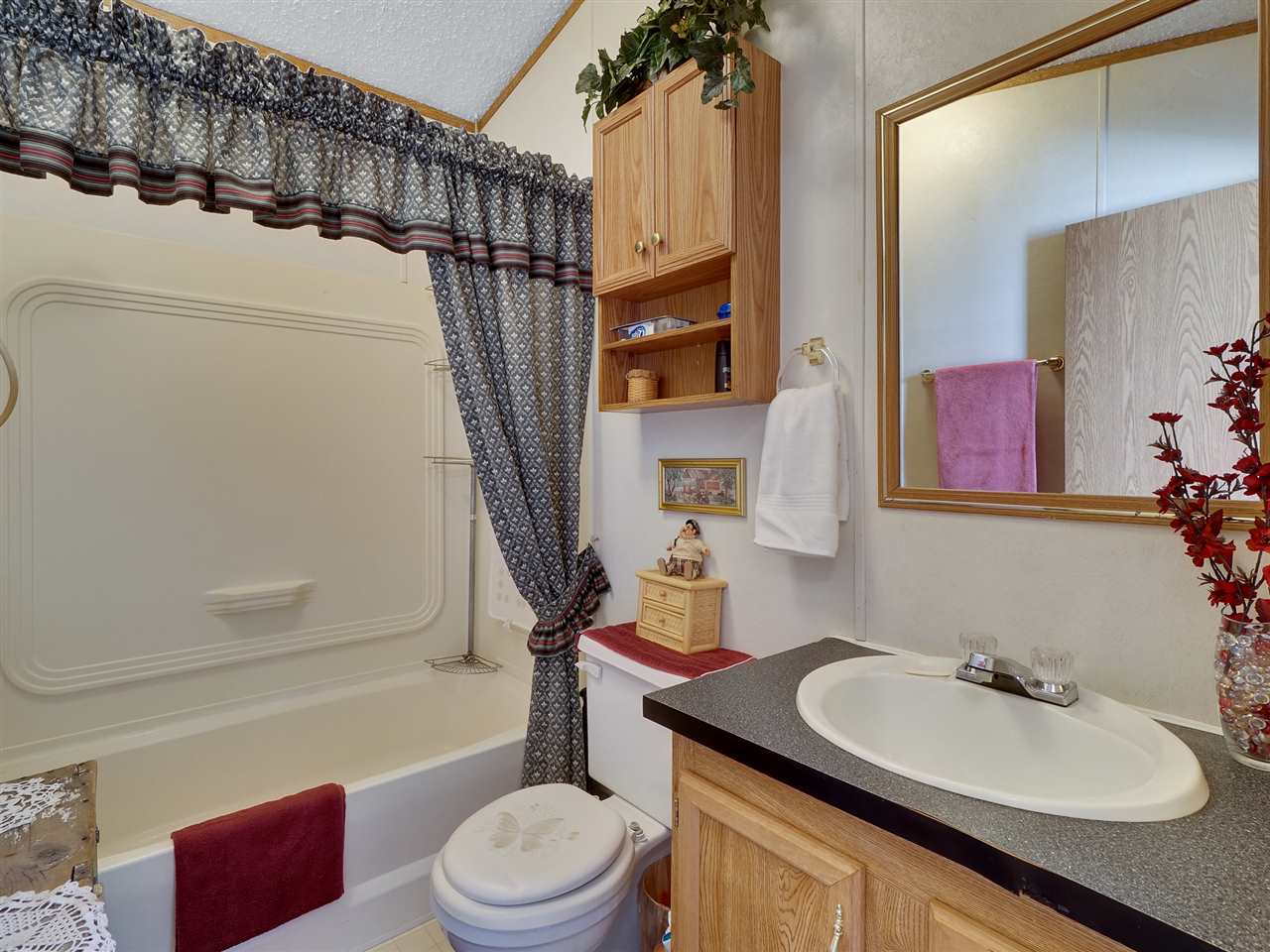 435 32 Road, Unit 705 Clifton, CO 81520 - Photo 12 of 16 a bathroom with a granite countertop sink toilet and shower