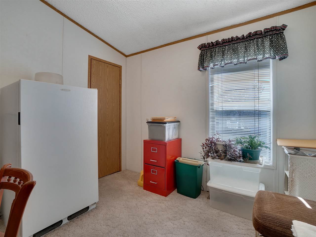 435 32 Road, Unit 705 Clifton, CO 81520 - Photo 13 of 16 a living room with furniture and a window