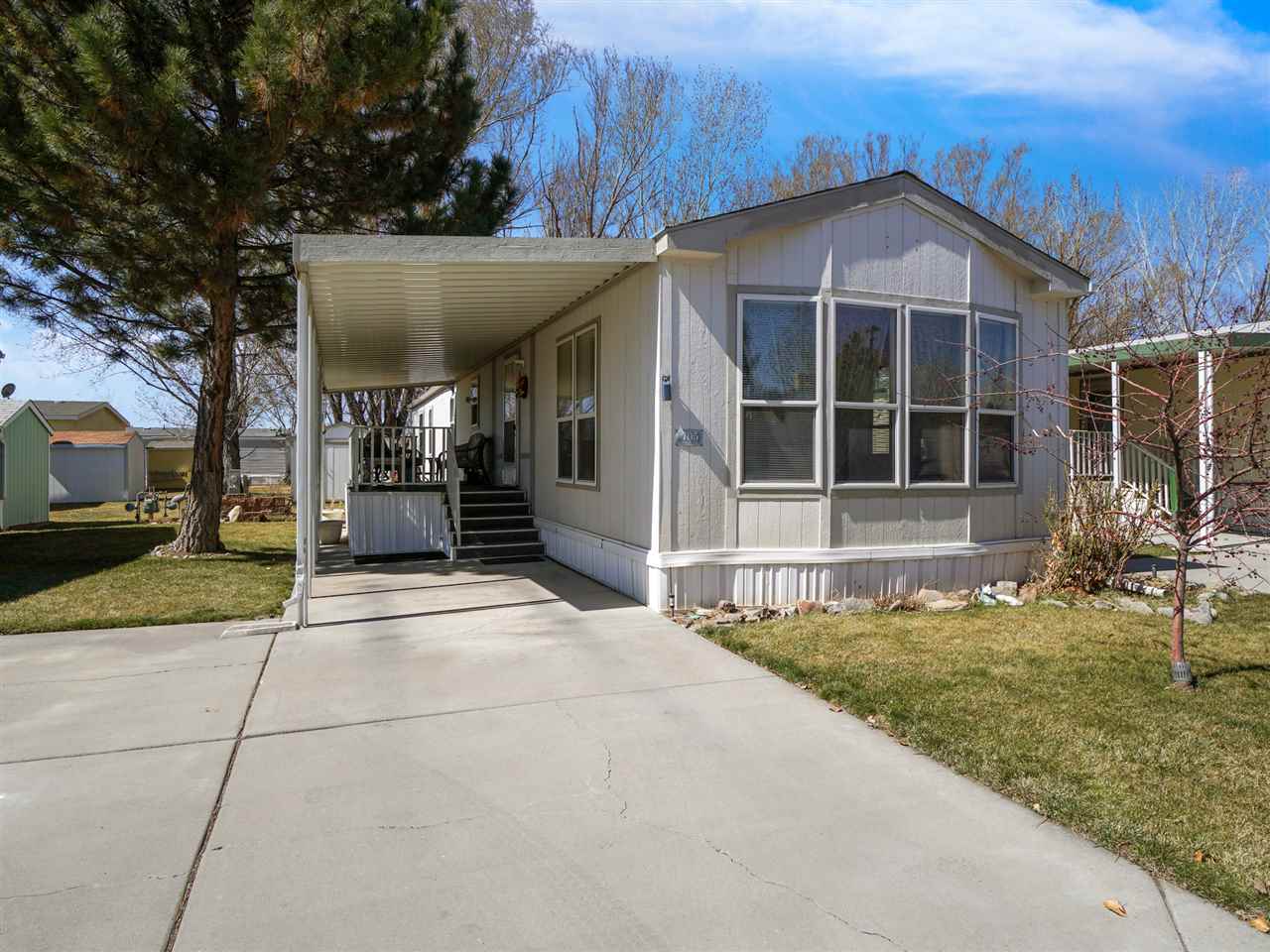 435 32 Road, Unit 705 Clifton, CO 81520 - Photo 2 of 16 a front view of a house with garden
