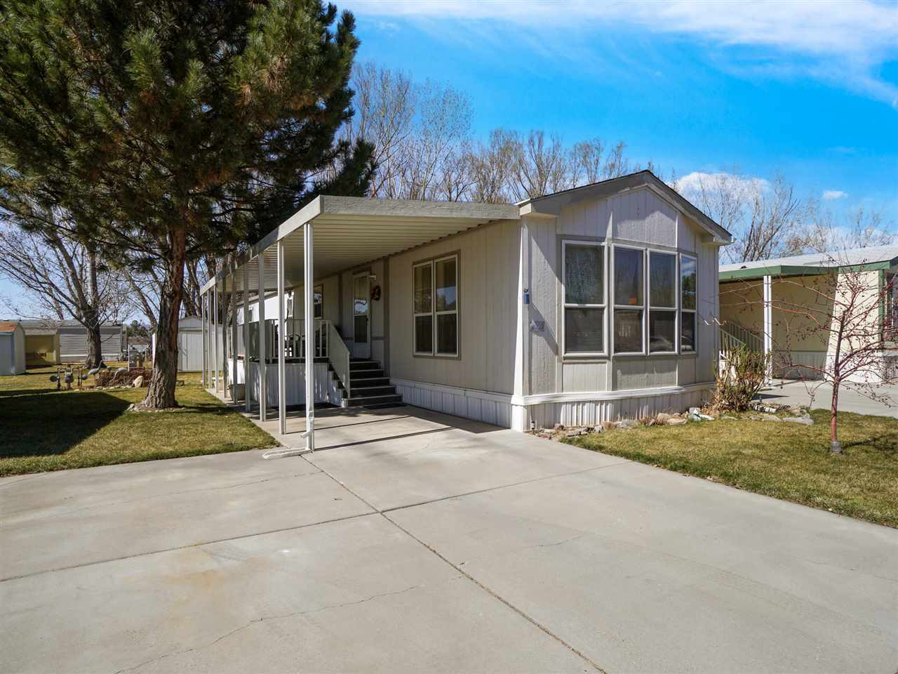 435 32 Road, Unit 705 Clifton, CO 81520 - Photo 3 of 16 a view of a house with a yard and tree s