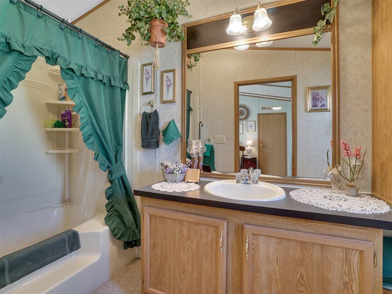 435 32 Road, Unit 705 Clifton, CO 81520 - Photo 10 of 16 a bathroom with a sink and a mirror