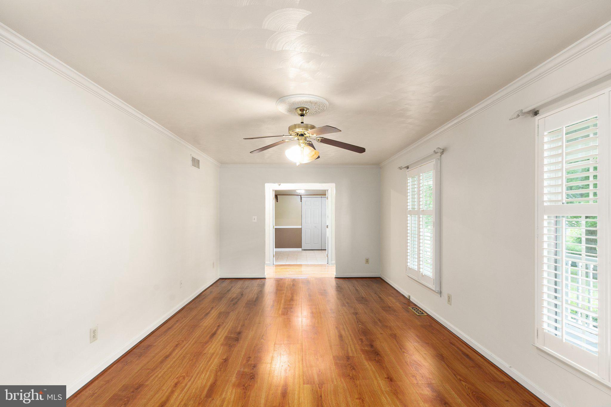 2311 Shannon Road Edgewood, MD 21040 - Photo 10 of 29 a view of an empty room with wooden floor and a window