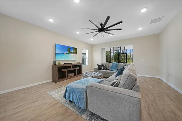 a living room with furniture and a large window