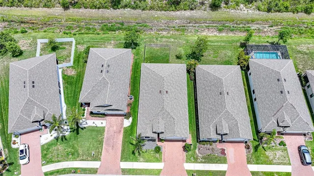 an aerial view of a house with a garden and plants