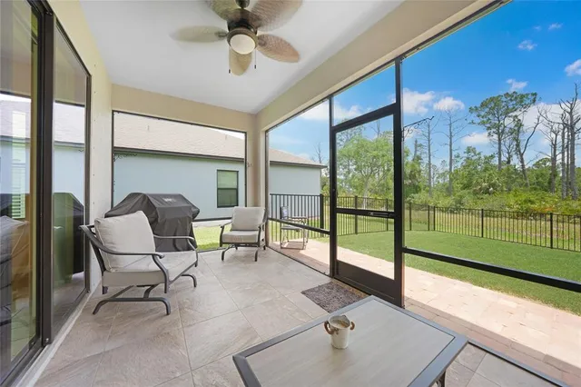 a view of a room with porch and a backyard