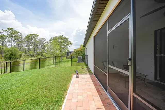 a view of a park and a large trees