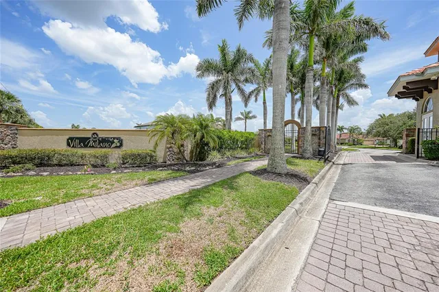 an aerial view of multiple houses with yard