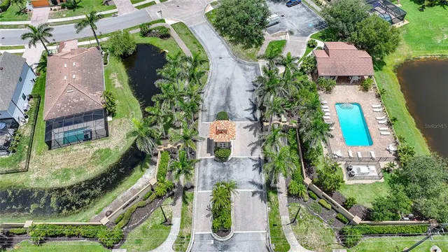 an aerial view of a house with a garden and swimming pool