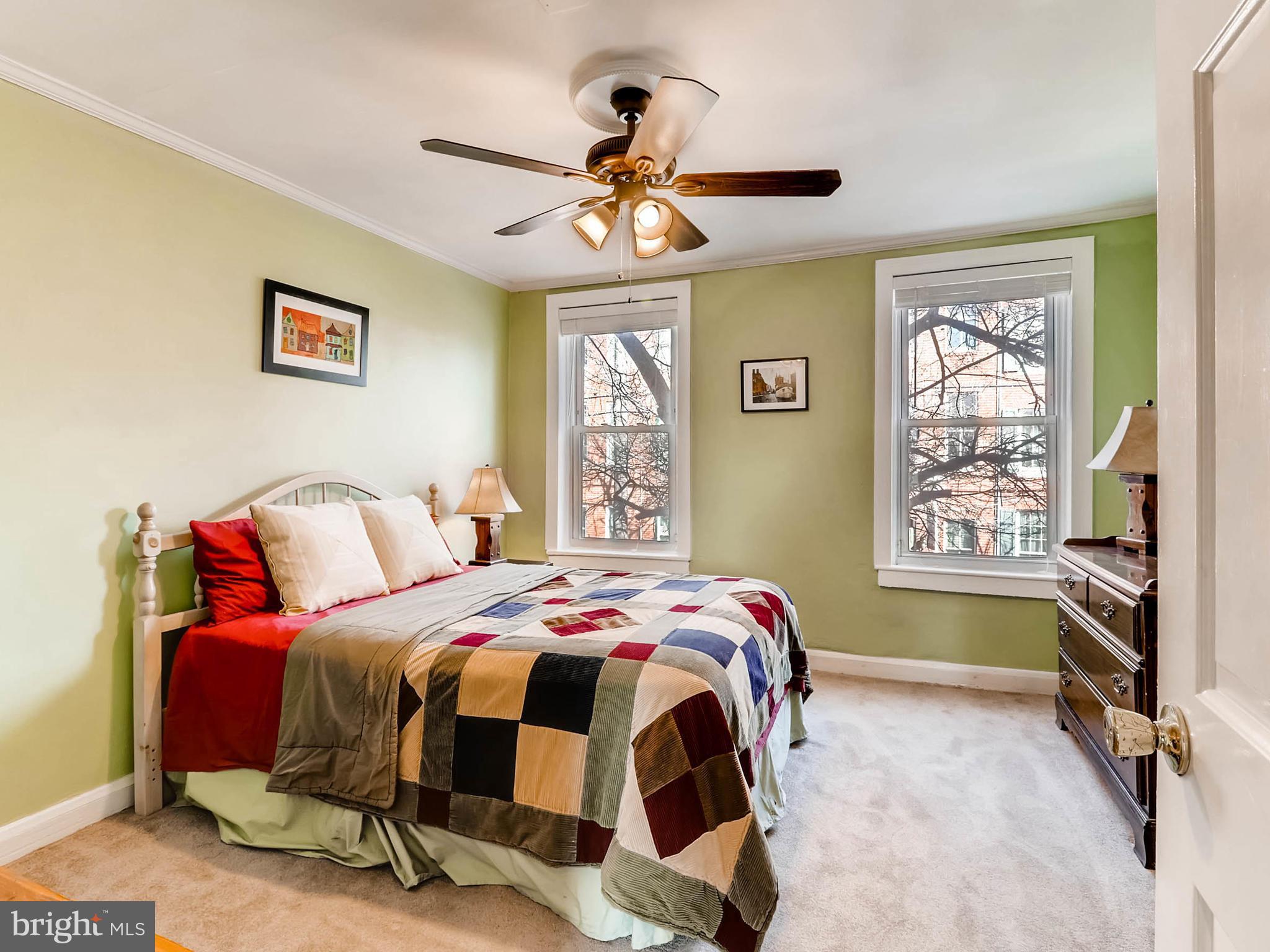 1212 Riverside Avenue Baltimore, MD 21230 - Photo 17 of 27 a bedroom with a bed and a chandelier
