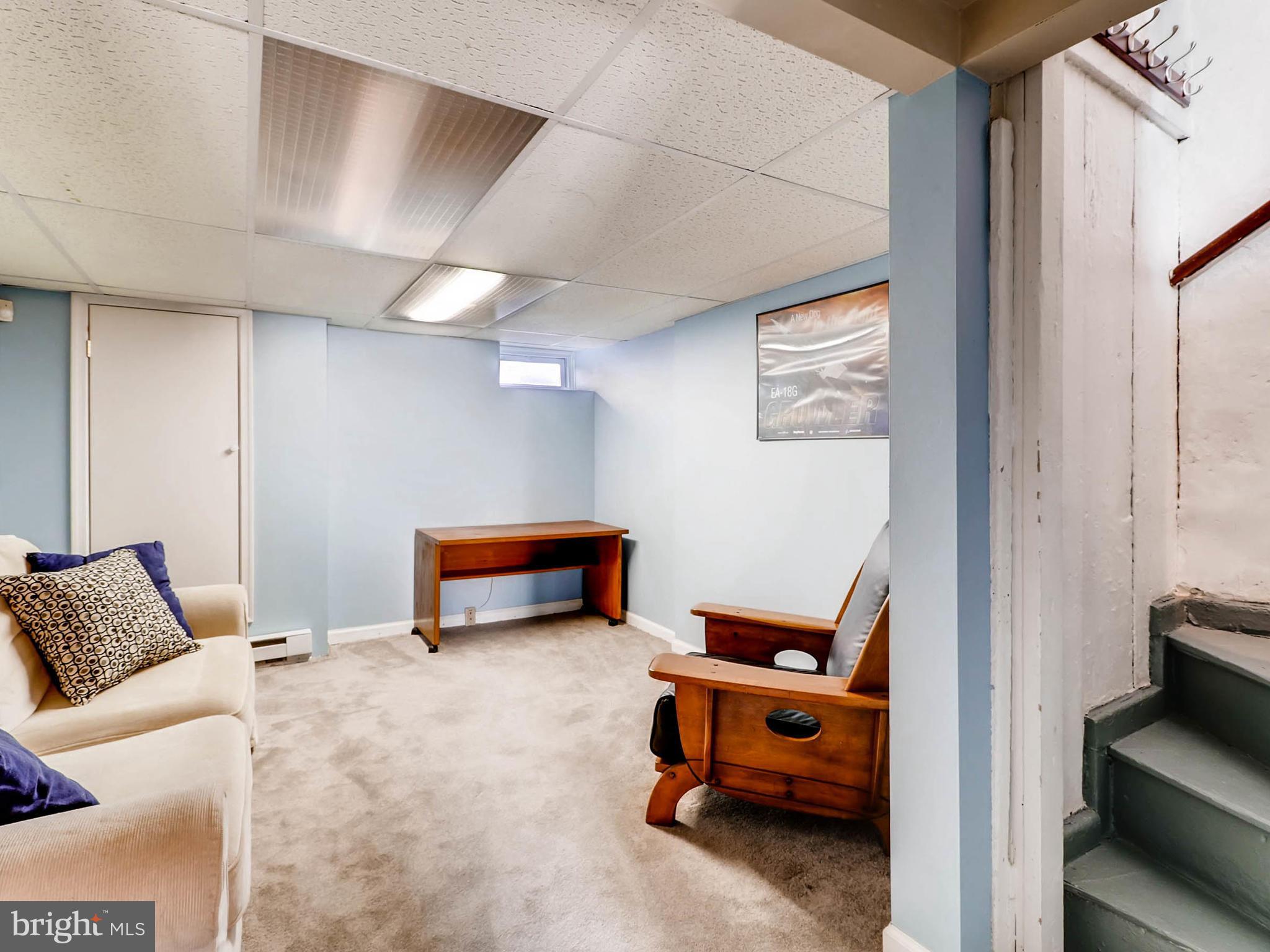 1212 Riverside Avenue Baltimore, MD 21230 - Photo 21 of 27 a bedroom with furniture and a lamp