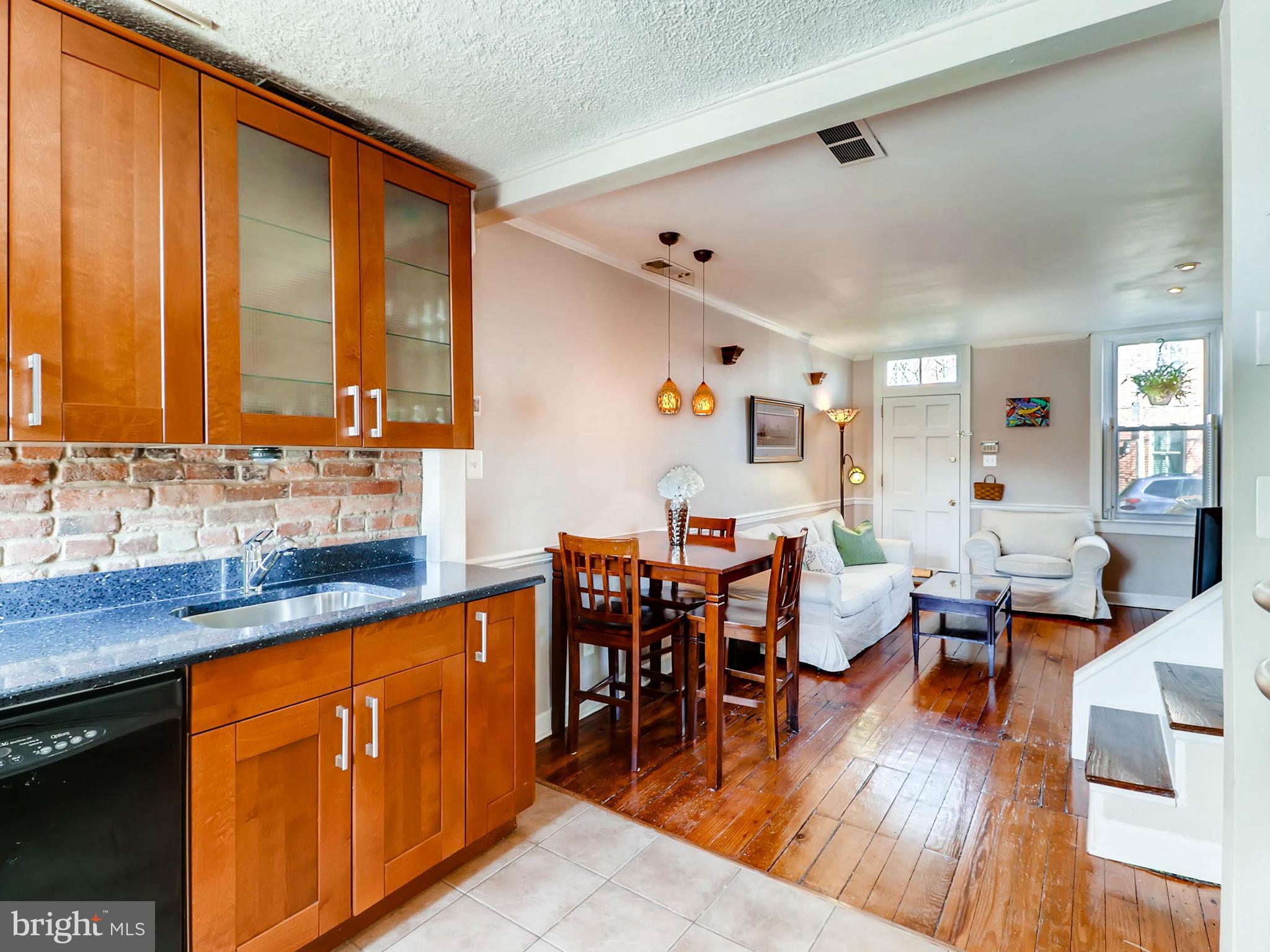 1212 Riverside Avenue Baltimore, MD 21230 - Photo 10 of 27 a large kitchen with lots of counter and chairs