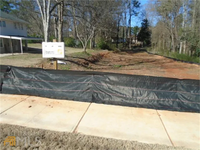 a view of a yard with trees