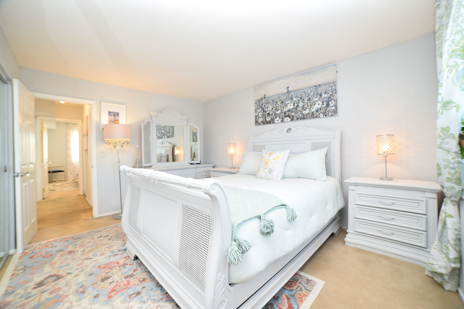 704 Cobblestone Circle, Unit 3E Glenview, IL 60025 - Photo 17 of 21 a spacious bedroom with a bed and a couch