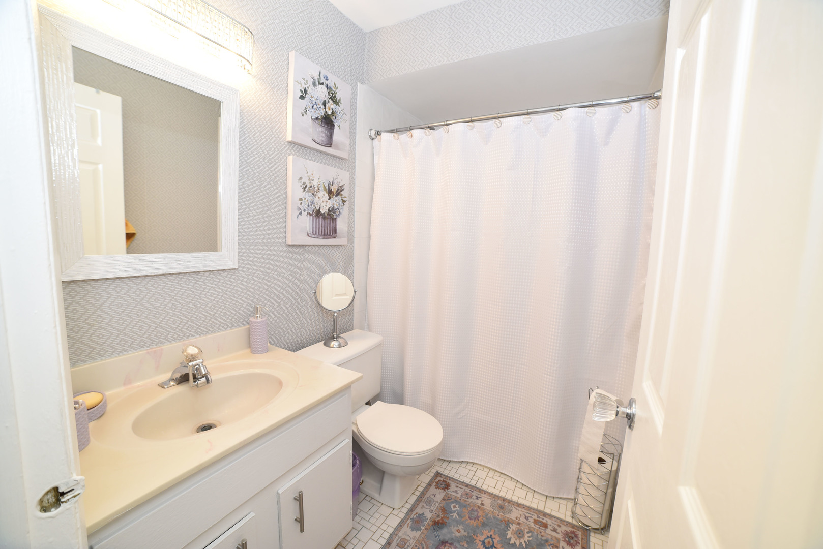 704 Cobblestone Circle, Unit 3E Glenview, IL 60025 - Photo 18 of 21 a bathroom with a sink and a mirror