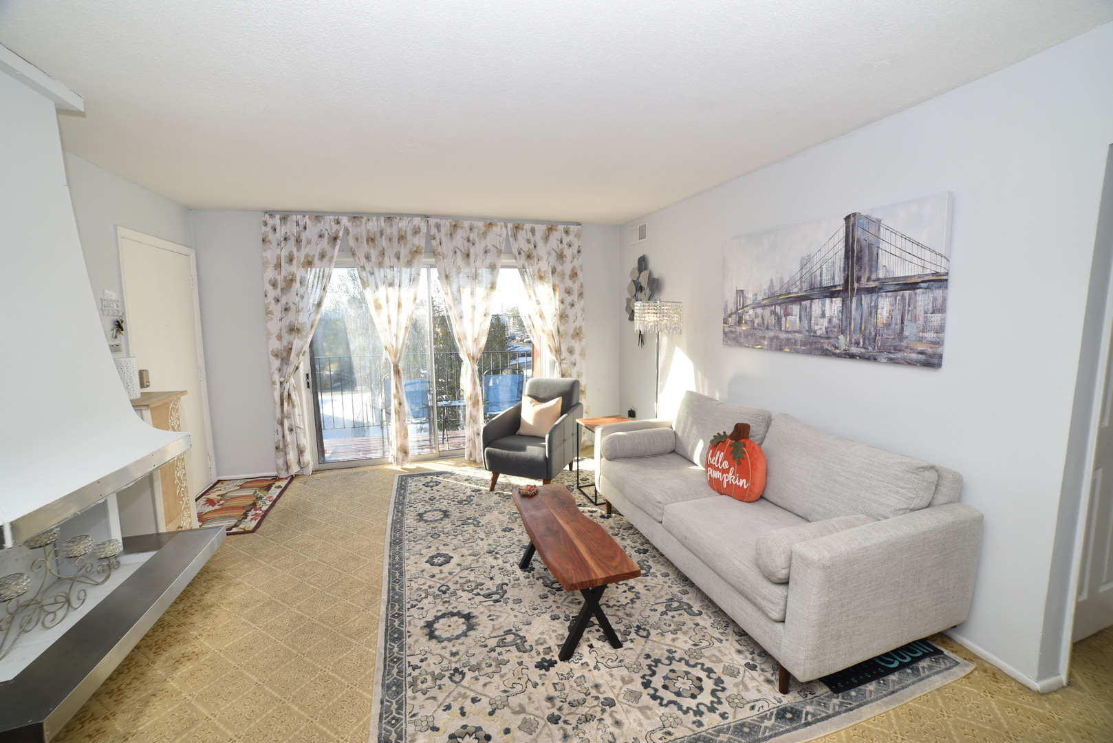 704 Cobblestone Circle, Unit 3E Glenview, IL 60025 - Photo 5 of 21 a living room with furniture and a large window