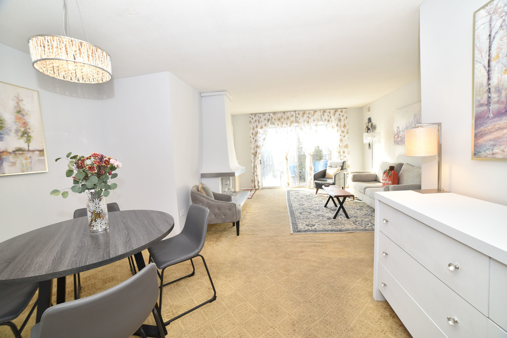 704 Cobblestone Circle, Unit 3E Glenview, IL 60025 - Photo 8 of 21 a living room with furniture and a table