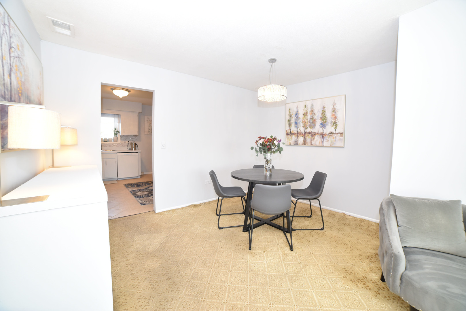 704 Cobblestone Circle, Unit 3E Glenview, IL 60025 - Photo 9 of 21 a view of a dining room with furniture and wooden floor