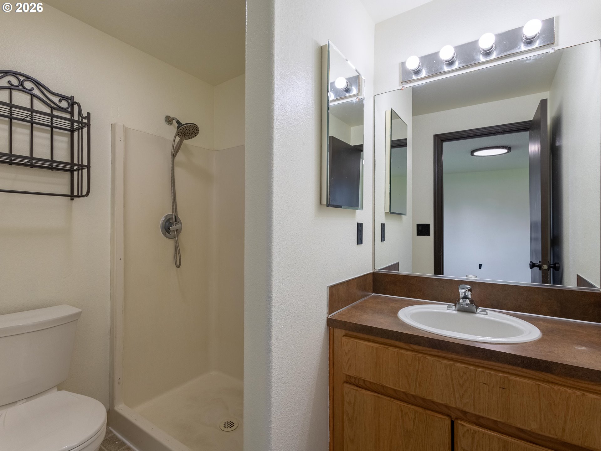 304 East Wilson Street Yacolt, WA 98675 - Photo 13 of 29 a bathroom with a sink toilet and shower