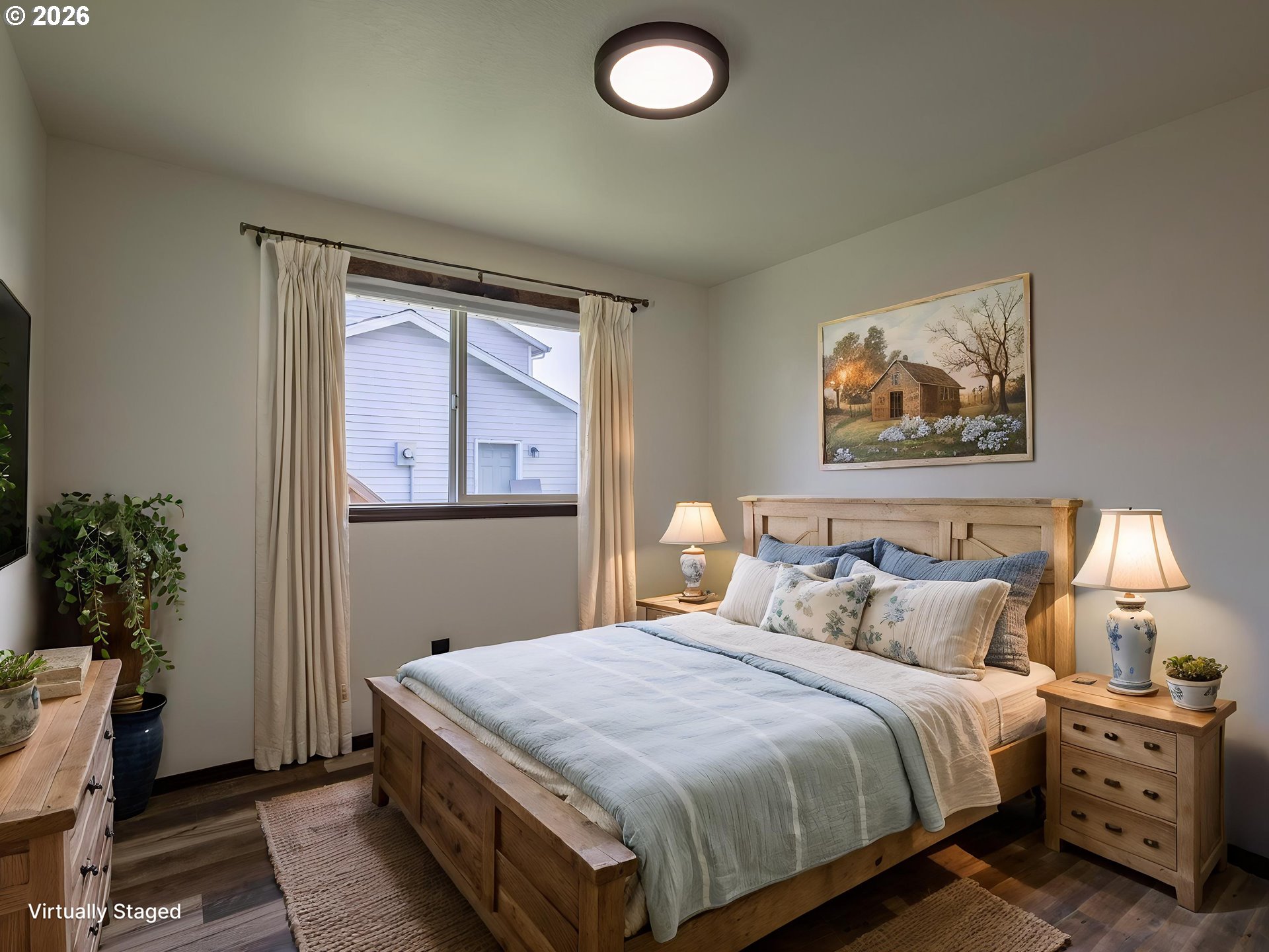 304 East Wilson Street Yacolt, WA 98675 - Photo 17 of 29 a bedroom with a bed and a potted plant