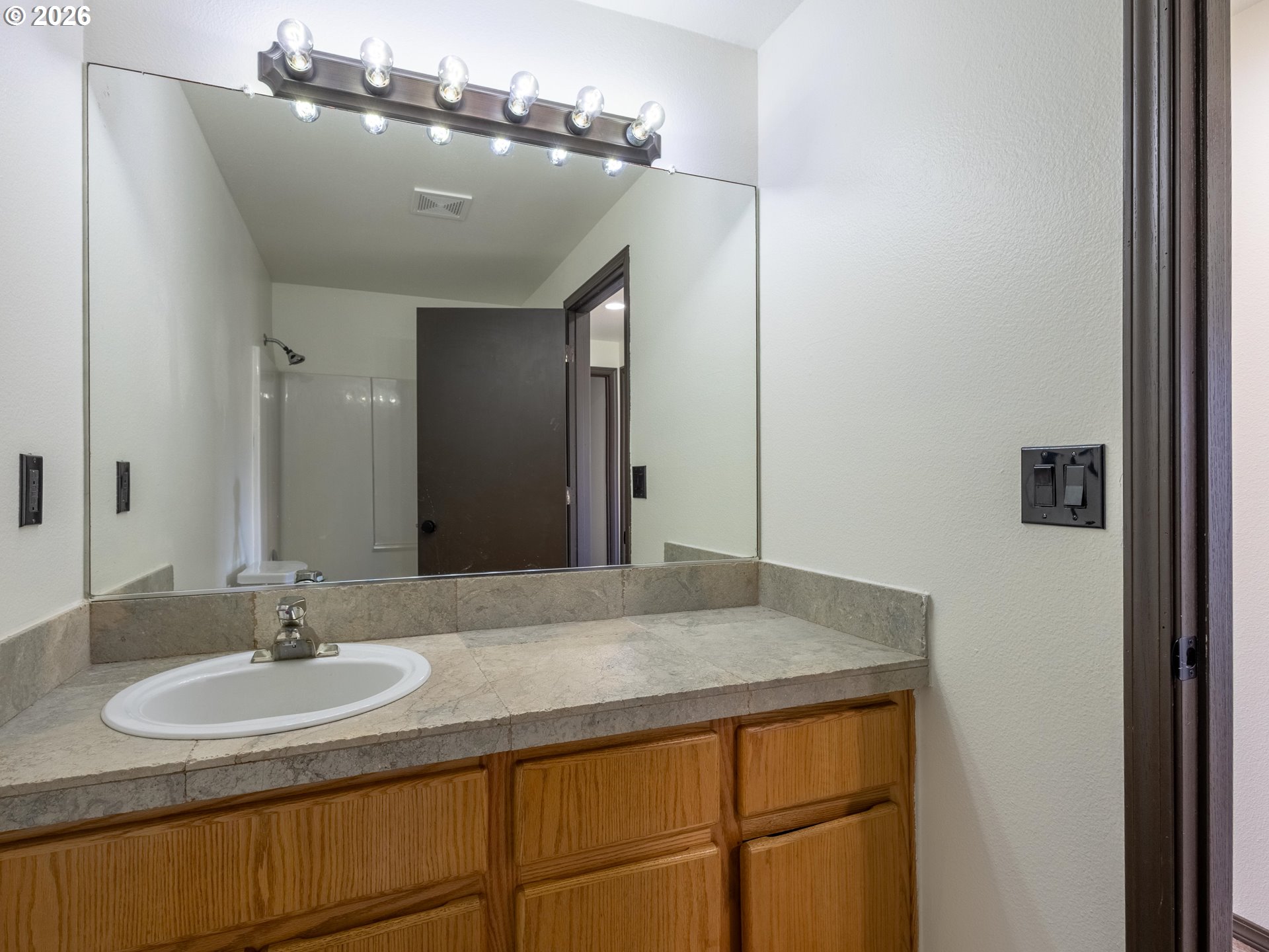 304 East Wilson Street Yacolt, WA 98675 - Photo 18 of 29 a bathroom with a sink and a mirror